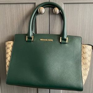 This is a medium size emerald with tan Michael Kors bag